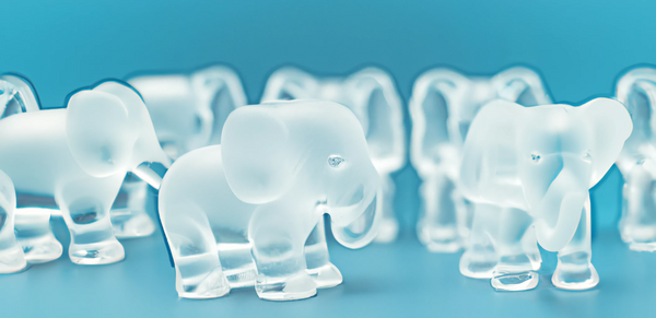 Lots of transparent elephants on a blue background.